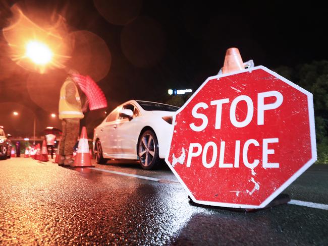 1am August 8 2020, Gold Coast Highway Coolanagatta Queensland - Queensland Police Officers with the assistance of The Australian Army stop all traffic into Queensland for checks at 1am on QLD/NSW border crossing due to increased lockdown of the State of QueenslandScott Powick Newscorp