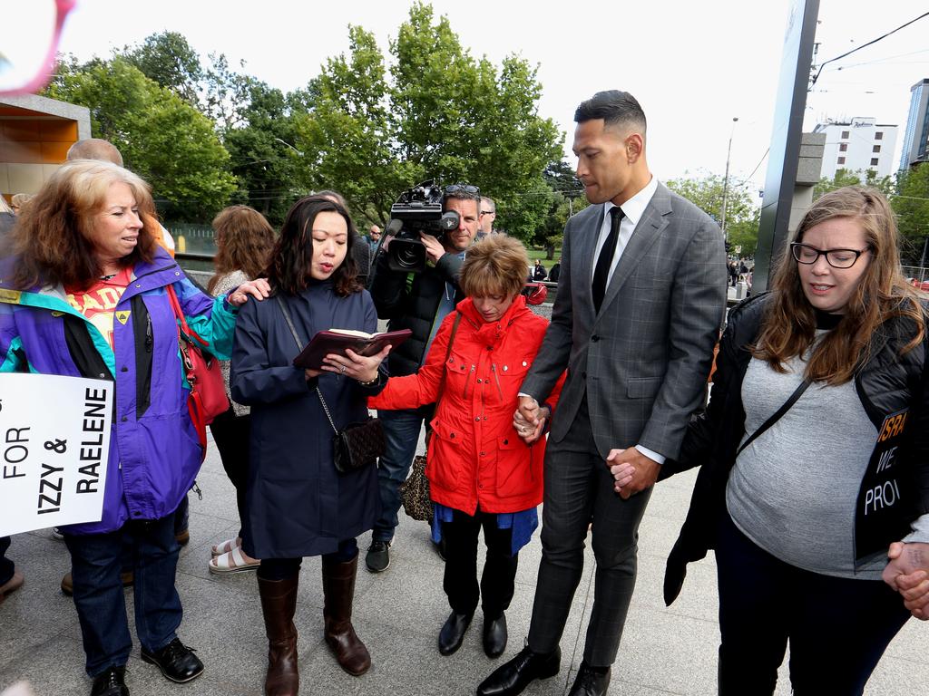 Folau joined in prayer with supporters at Federal court in Melbourne.