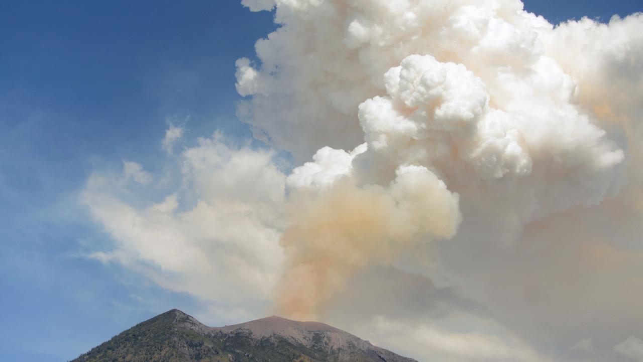 Plumes of ash filled the sky after Mount Agung volcano erupts in the Kubu subdistrict in Karangasem Regency on Indonesia's resort island of Bali. Picture: AFP PHOTO / SONNY TUMBELAKA