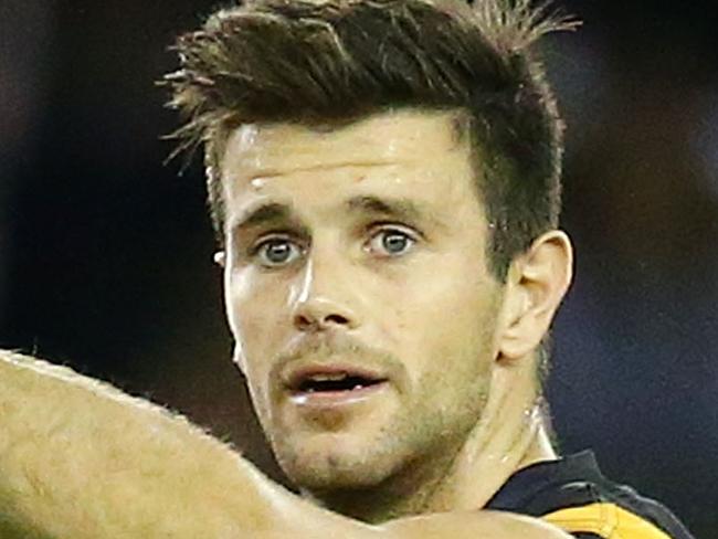MELBOURNE, AUSTRALIA - APRIL 09: Trent Cotchin, captain of the Richmond Tigers directs his teammates during the round three AFL match between the Richmond Tigers and the Adelaide Crows at Etihad Stadium on April 9, 2016 in Melbourne, Australia. (Photo by Scott Barbour/Getty Images)