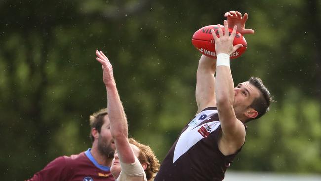 Adrian Del Monte marks strongly against Marcellin. Picture: Stuart Milligan