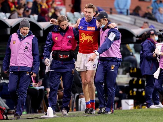 Harris Andrews left the field in pain, but made it back for the Lions. Picture: AFL Photos/Getty Images