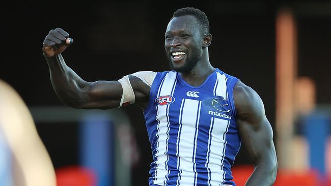 Majak Daw celebrates a goal last season for North Melbourne.