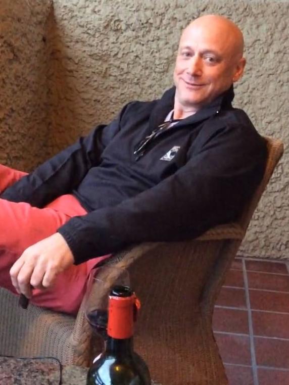 It’s hardly a tough life for Mr Vesey, seen relaxing in a luxury airport lounge. Source: Vimeo