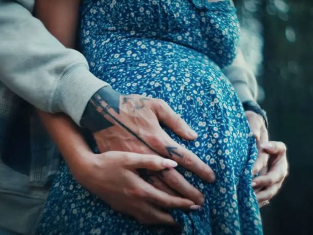 The couple sparked pregnancy speculation earlier this year in MGK’s Lonely Road music video. Picture: YouTube