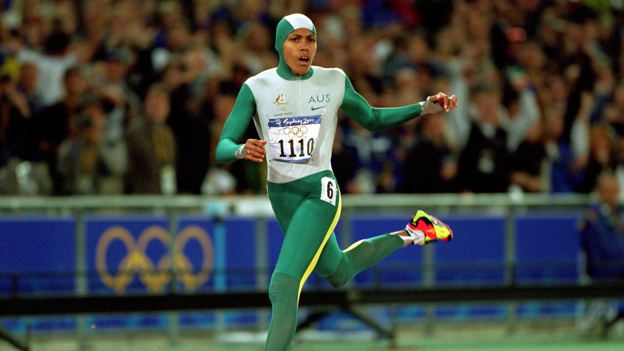 25 Sep 2000: Cathy Freeman of Australia crosses the line to win gold in the Womens 400m Final at the Olympic Stadium on Day 10 of the Sydney 2000 Olympic Games in Sydney, Australia. \\ Mandatory Credit: Mike Powell /Allsport