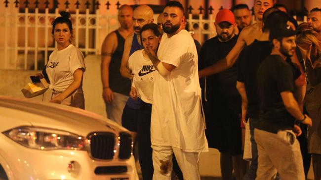 Maghnie’s son arrives at the scene dressed in a hospital gown. Picture by Wayne