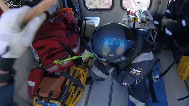 CareFlight rescuers come to the aid of helicopter crash victims. Video: CareFlight