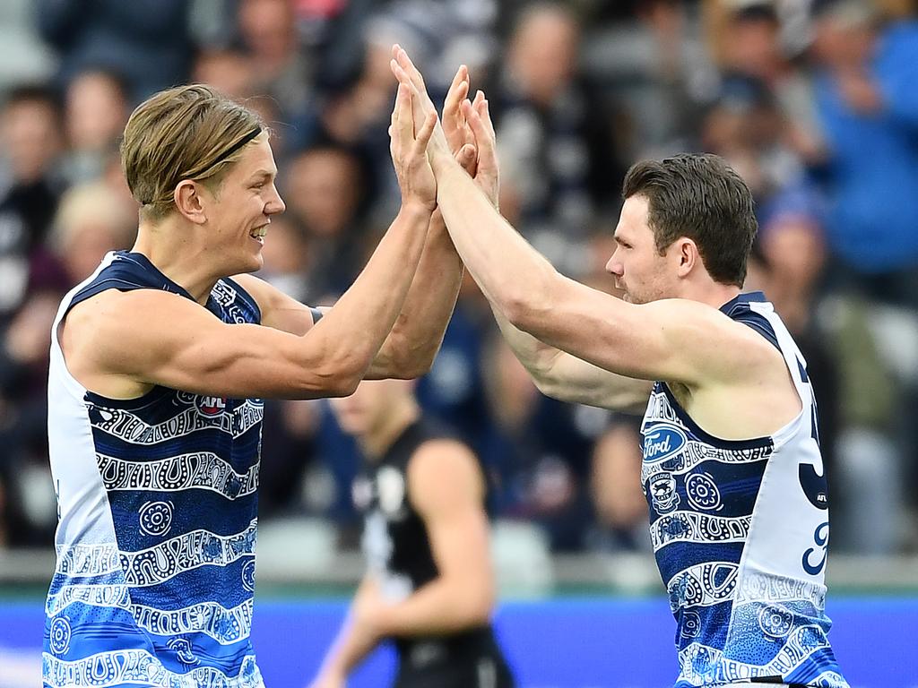 GEELONG, AUSTRALIA - AUGUST 24: Patrick Dangerfield of the Cats is congratulated by Rhys Stanley after kicking a goal during the round 23 AFL match between the Geelong Cats and the Carlton Blues at GMHBA Stadium on August 24, 2019 in Geelong, Australia. (Photo by Quinn Rooney/Getty Images)