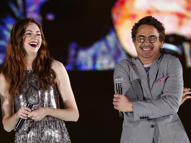 Gillan and Downey share a laugh at the Avengers: Infinity War red carpet fan event in Singapore. Picture: AP Photo/Yong Teck Lim