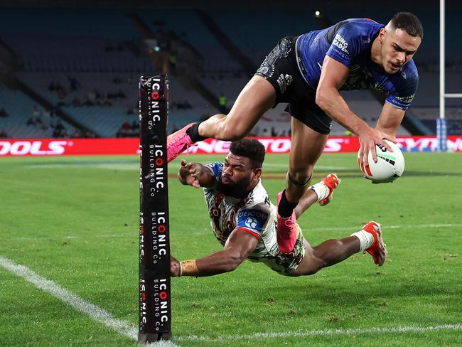 SYDNEY, AUSTRALIA - MAY 23:  Jacob Kiraz of the Bulldogs scores a try during the round 12 NRL match between Canterbury Bulldogs and St George Illawarra Dragons at Accor Stadium on May 23, 2024, in Sydney, Australia. (Photo by Cameron Spencer/Getty Images)