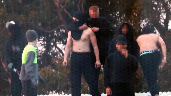 Inmates from the Frank Baxter Juvenile corrections centre Kariong taunt police from the roof. Picture: John Grainger