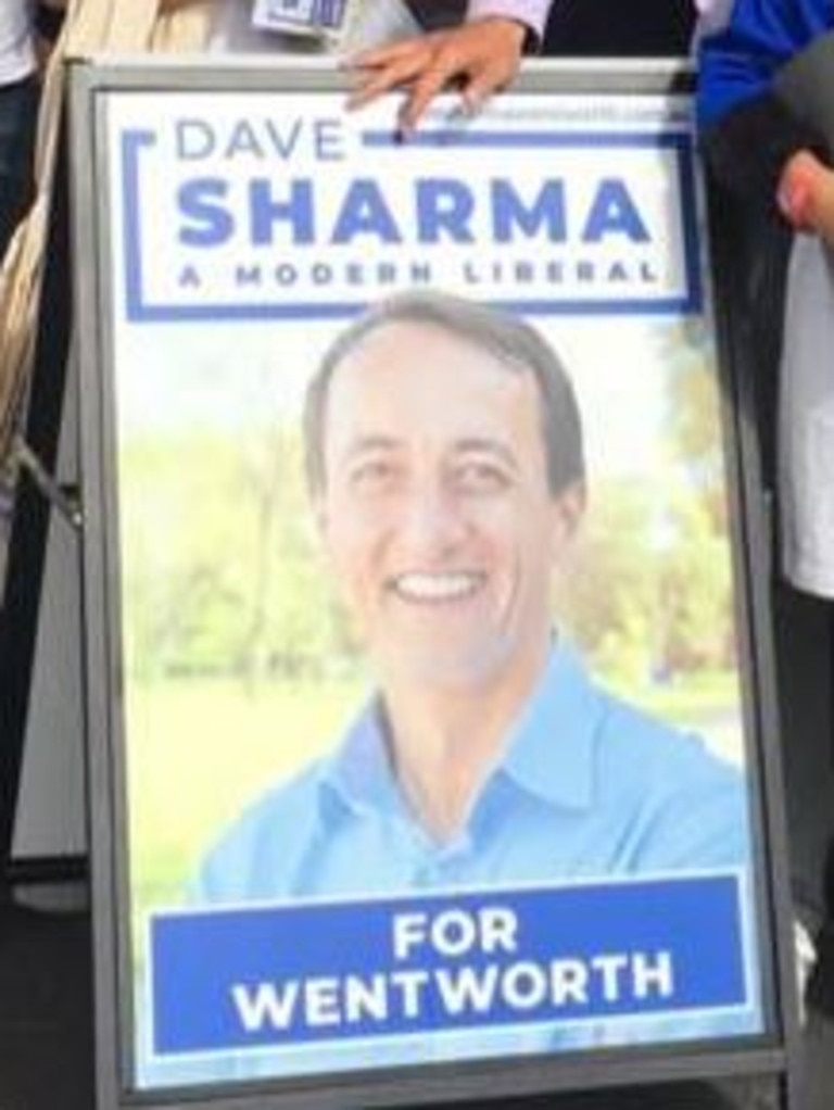 Dave Sharma's new election material has a big change compared to last year's signs.