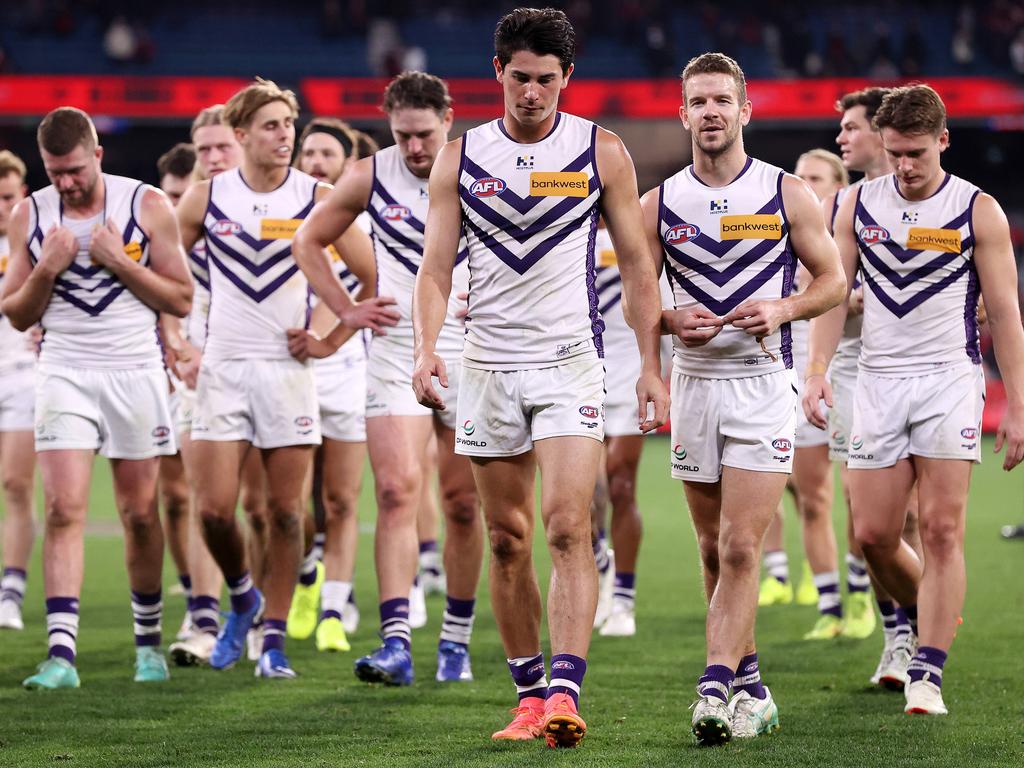 A dejected Fremantle head off after losing to Essendon at the MCG. Picture: Mark Stewart