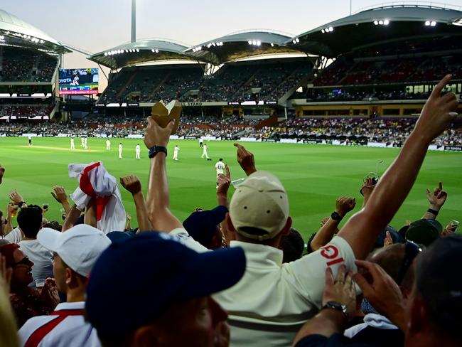 ADELAIDE, AUSTRALIA - DECEMBER 18:  Spectators in the crowd enjoy the atmosphere during day three of the Second Test match in the Ashes series between Australia and England at the Adelaide Oval on December 18, 2021 in Adelaide, Australia. (Photo by Quinn Rooney/Getty Images)