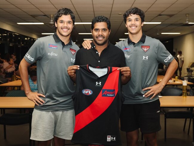 Jayden Davey, Alwyn Davey Sr and Alwyn Davey Jr after the twins were officially selected by Essendon in the AFL National Draft. Picture: Essendon Football Club