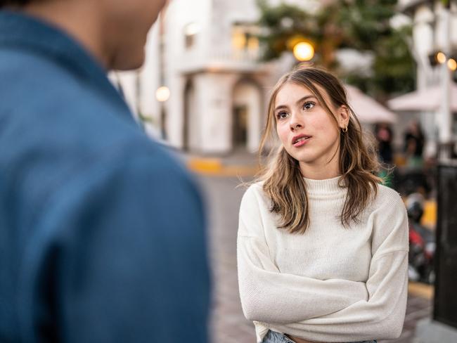 Young couple having an argument outdoors