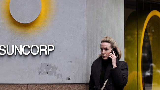 A pedestrian walks past a Suncorp Bank branch in Melbourne