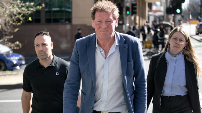 Controversial AFL identity Ricky Nixon leaving the Melbourne Magistrates’ Court on Friday. Picture: Luis Enrique Ascui