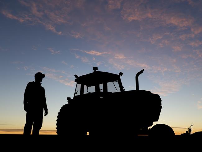 Generic farmer in a paddock with tractor