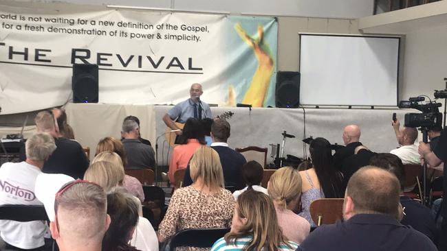 The Revival Church pastor Paul Furlong sings to parishioners during a service in Narre Warren in breach of lockdown restrictions on Sunday. Picture: Twitter/@tdolling