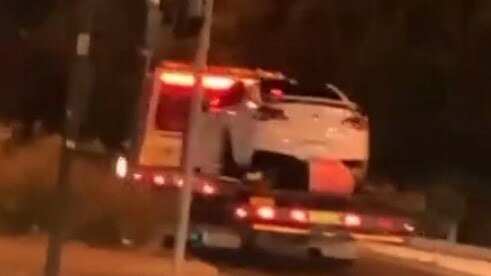 Screengrab of justadelaidethings Instagram repost of Paul Krivitch, 57, from Norwood hitching a ride on the back of a tow truck to a car impound.