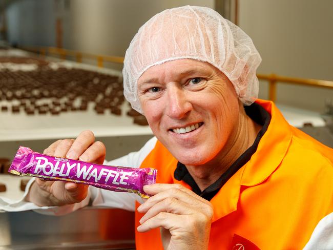 Robert Menz CEO Phil Sims with a Polly Waffle bar at the Glynde factory. Picture Matt Turner