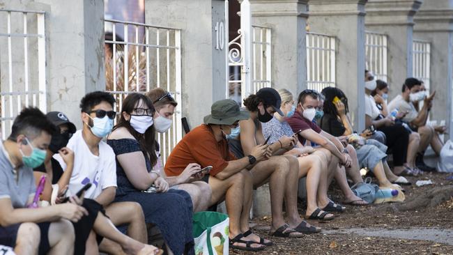 Members of the public in line at the COVID-19 Clinic at Perth Royal Hospital following the discovery of a positive case in a worker at a quarantine hotel. Photo: Matt Jelonek/Getty Images