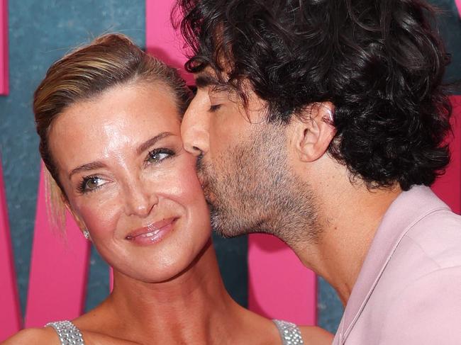 US actor Justin Baldoni kisses his wife Emily Baldoni as they attend the New York premiere of "It Ends With Us" at at AMC Lincoln Square in New York, August 6, 2024. (Photo by Charly TRIBALLEAU / AFP)