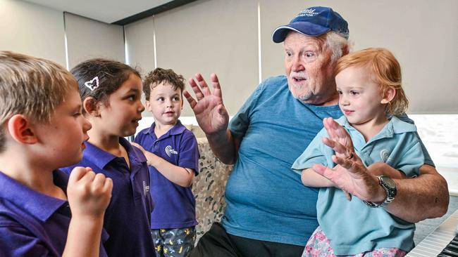 ECH Encore Apartments resident Foster Smith with Montessori students. Picture: Brenton Edwards