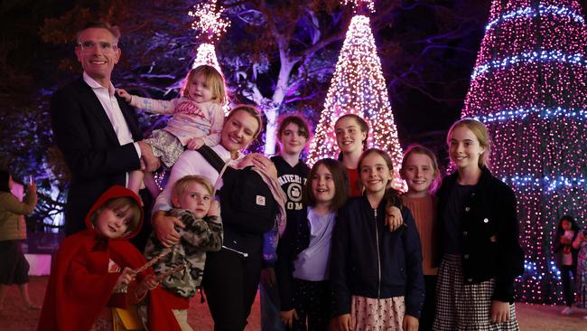 NSW Premier Dominic Perrottet with his wife Helen and their children plus some cousins visit the Noel Christmas markets at the Royal Botanic Garden Sydney. Picture: Jonathan Ng