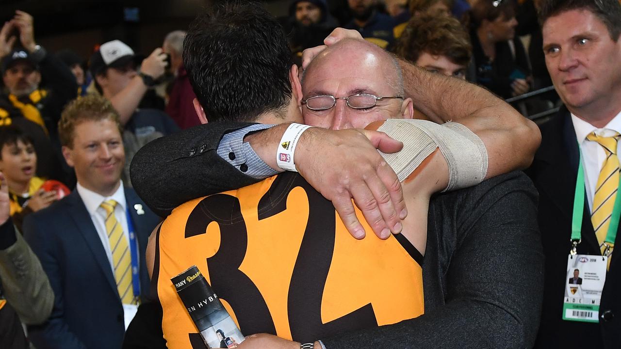 David Mirra embraces his father following his debut on Sunday.
