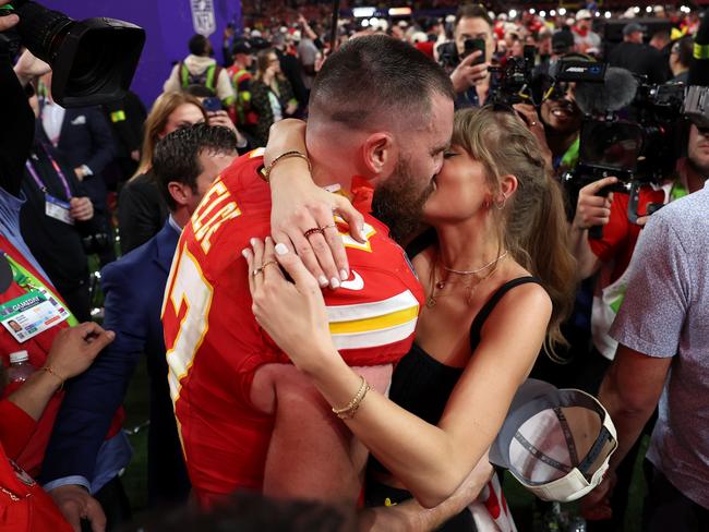The Kansas City Chiefs star kisses Swift after his team’s Super Bowl win in February. Picture: Ezra Shaw/Getty Images
