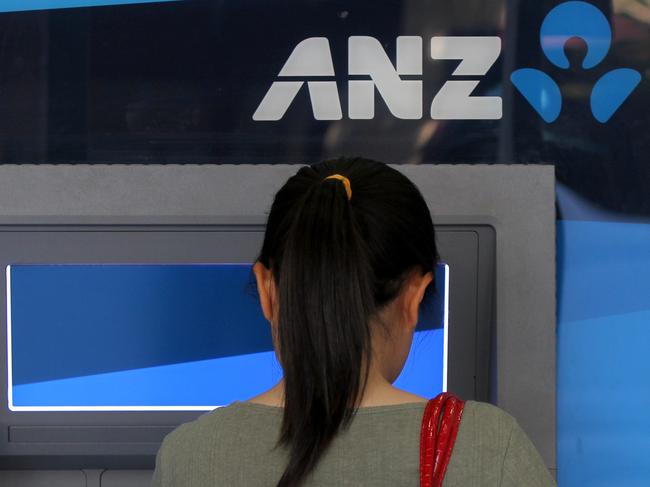 Generic picture of a woman using an ANZ ATM in Sydney.