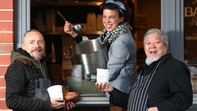 SOUPER BOWL: Simon Bryant, Georgie Rogers and Cheong Liew manning the new soup kitchen at East End Cellars, where proceeds will aid the Hutt St Centre. Picture: TAIT SCHMAAL