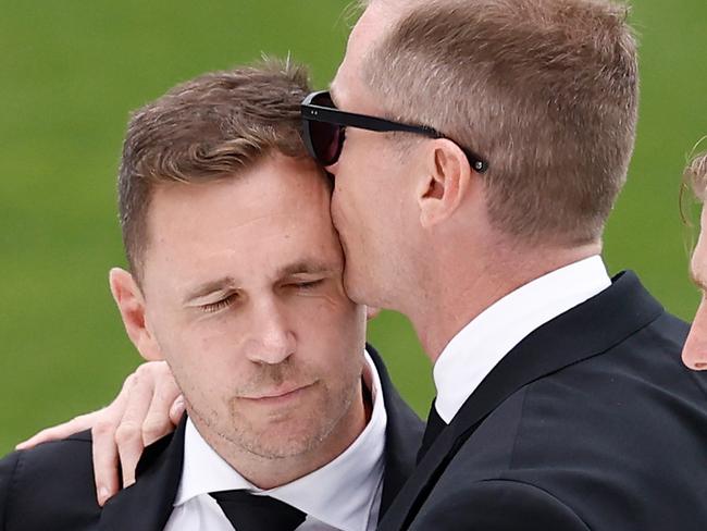 GEELONG, AUSTRALIA - FEBRUARY 14: (L-R) Joel Selwood, Adam Selwood and Scott Selwood embrace during Troy Selwood's Funeral Service at GMHBA Stadium on February 14, 2025 in Geelong, Australia. (Photo by Michael Willson/AFL Photos via Getty Images)