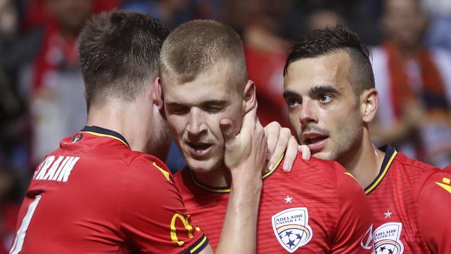 Riley McGree, centre, after his second goal, with teammates Ryan Strain and Nikola Mileusnic. Picture: Sarah Reed