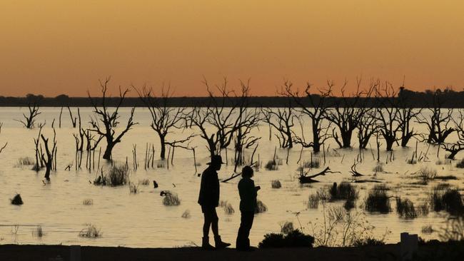 Residents walk along Lake Menindee in far-western New South Wales. Picture: Getty Images