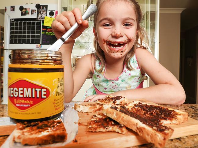 Laura Bently and her four children eating vegemite toast. Indie Creham, 6, loves Vegemite. Picture: NIGEL HALLETT