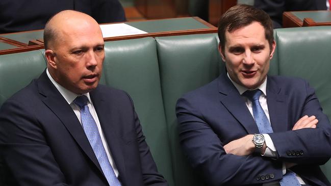 Peter Dutton and Alex Hawke in the House of Representatives Chamber at Parliament House in Canberra. Picture: Kym Smith