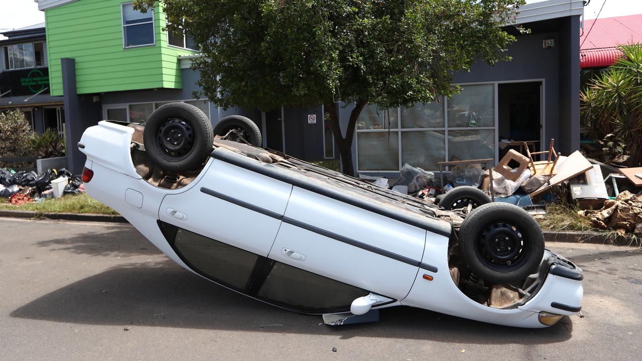 FoAn overturned car in Dawson St Lismore in the aftermath of the devastating floods. Photograph: Jason O'Brien