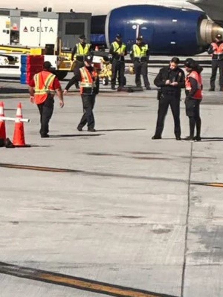 The plane returned to the gate and passengers were escorted off and transported to another plane. Picture: Gillian Sheldon via Twitter