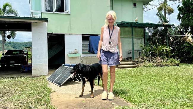 Camille O'Sullivan, a Catholic Education teacher, outside her flood-ravaged home in Cordelia on the banks on the Herbert River. Picture: Cameron Bates