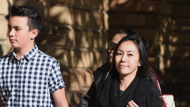 Keanu Dallas, left, and his mother Veny Amelia, right, outside the Supreme Court. Picture: Roger Wyman.