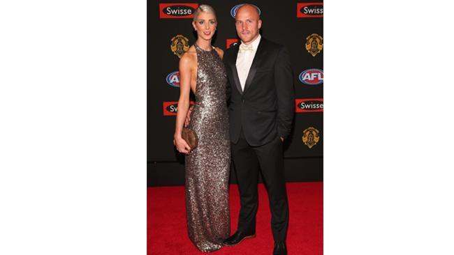 Nathan Jones of the Demons with wife Jerri, mixes it up with a white bow tie. Picture: Getty