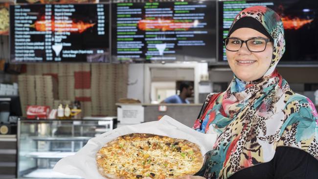 Elaa Maarbani with Guildford Mina Pizzeria’s enticing pizzas. Picture: Matthew Vasilescu