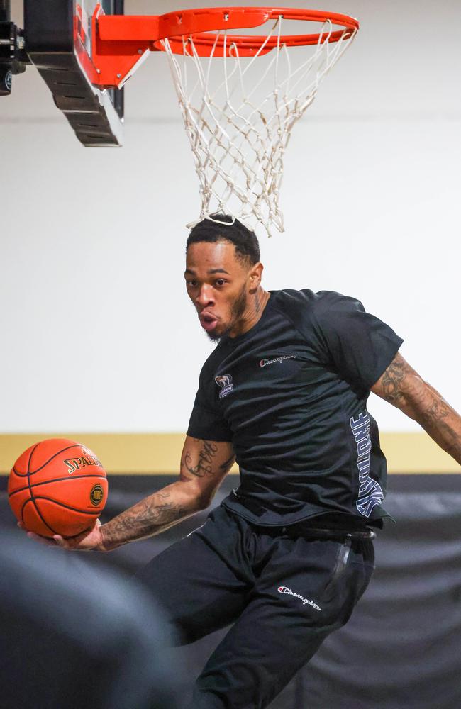 New Melbourne United ‘freak-of-nature’ Rayjon Tucker’s head kisses the net during practice. Picture: Brendan Beckett