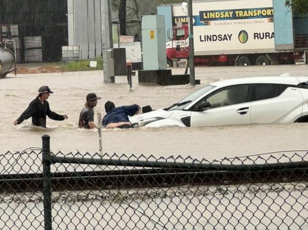 Bruce Highway closed, three saved from train as Far North cops heavy downpour