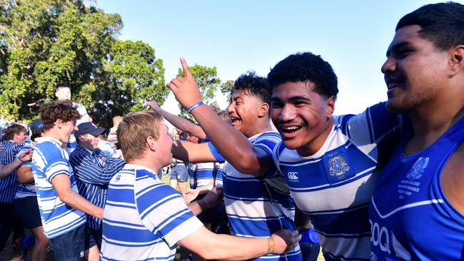 Rob Toia, right, celebrates with Nudgee players and supporters. Picture, John Gass