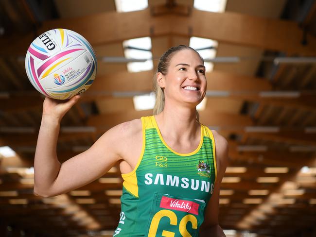 Diamonds player Caitlin Bassett poses for a photo in Sydney, Tuesday, June 25, 2019. The Australian Diamonds today launched their special edition home and away uniforms for the 2019 Netball World Cup in England. (AAP Image/Joel Carrett) NO ARCHIVING